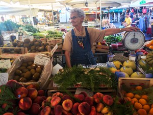 woman selling vegetables at a market