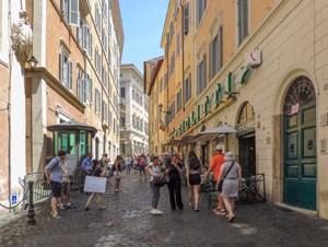 A street with colorful old buildings seen on walks in Rome