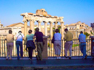 people looking an ancient ruins during walks in Rome