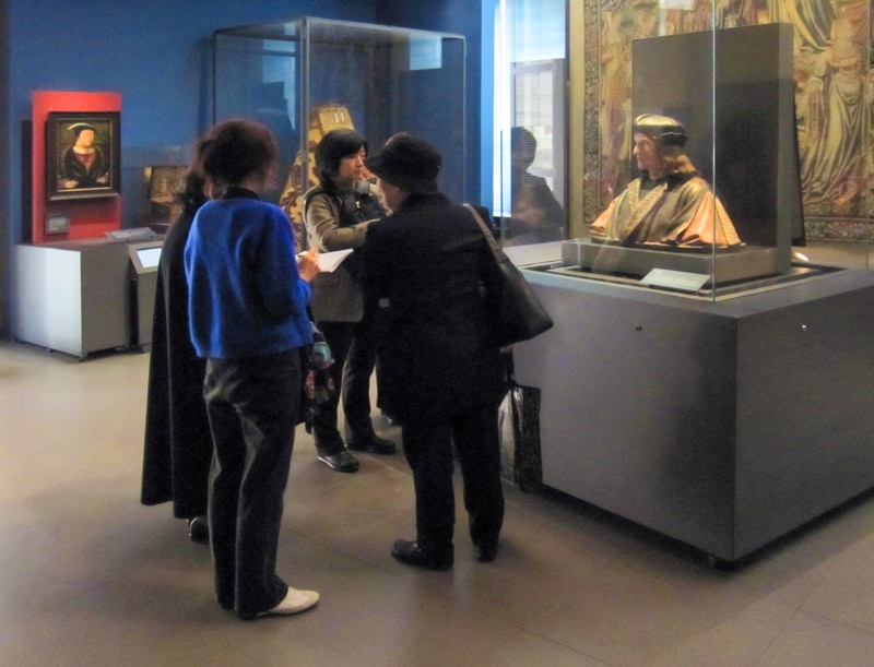 people by a bust in one of the museums in south Kensington