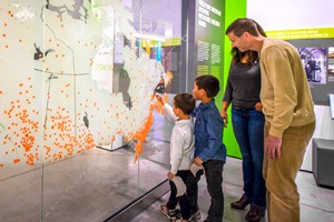 family looking at a museum display in Halifax, Nova Scotia