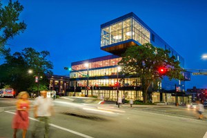 a modern glass building at night