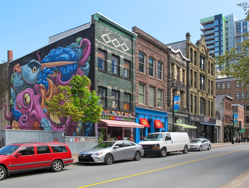 a large colorful mural on the side of a building