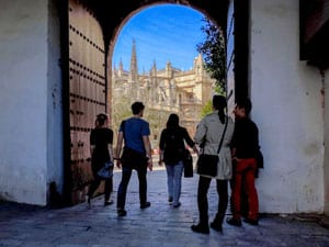 people in a doorway near a cathedral