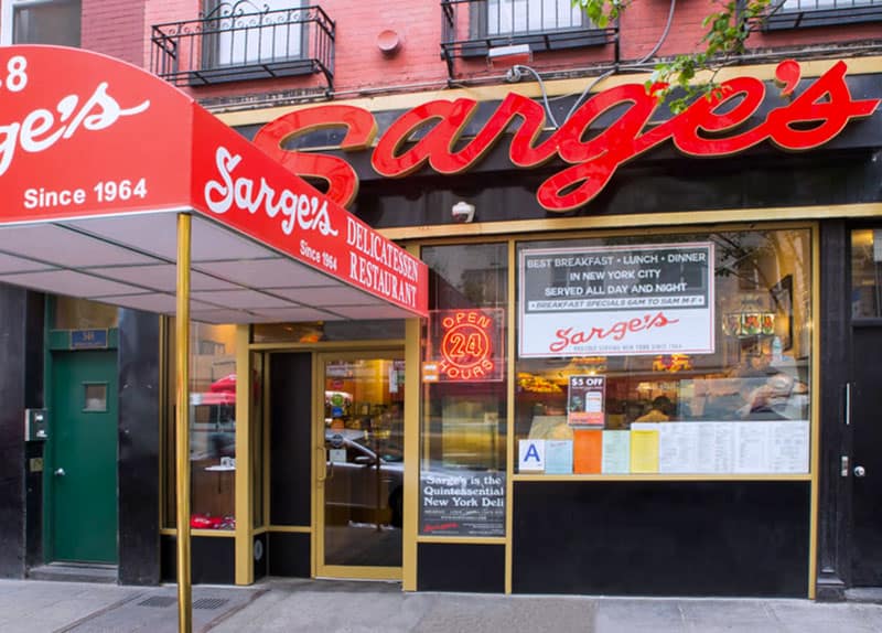 a red sign for Sarge's, one of the delis in New York City