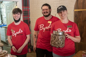 the staff of a cookie store in red shirts