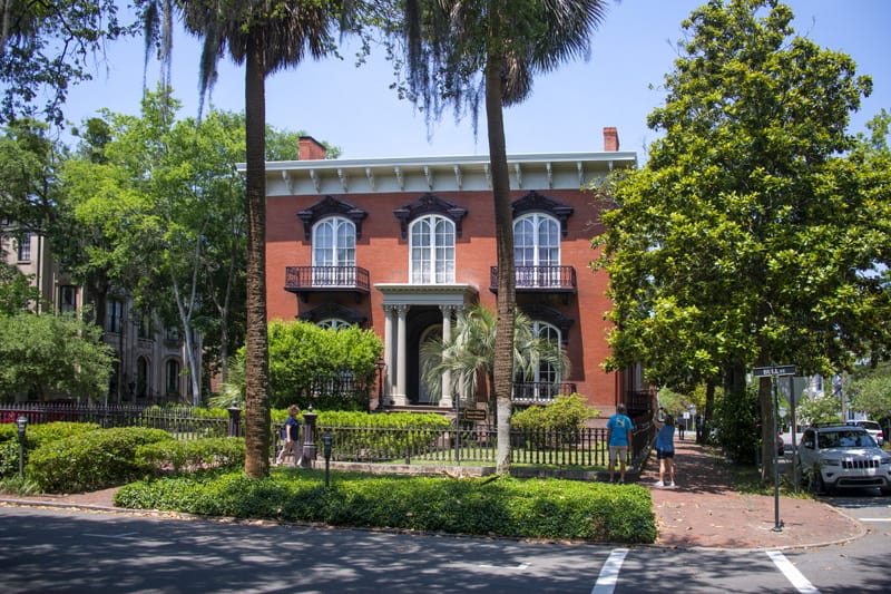people visiting a historical house, one of the things to do in Savannah