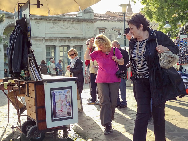 women in an outdoor art market