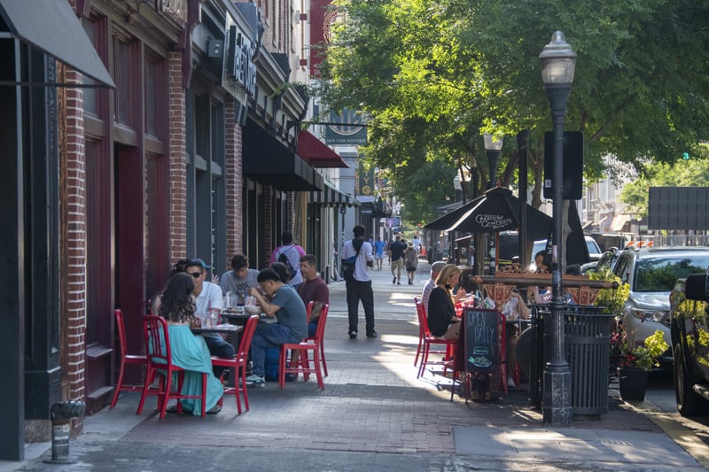 people dining at a sidewalk cafe