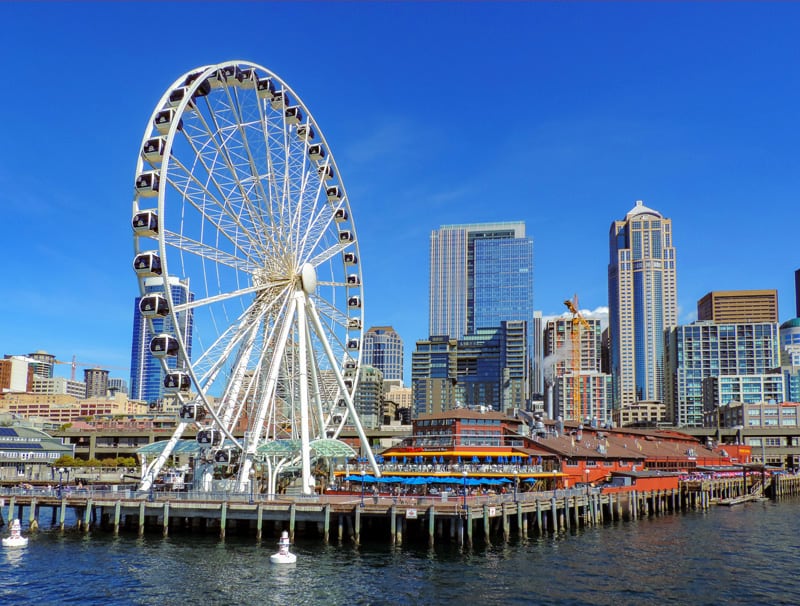 visiting a pier with a ferris wheel - one of the things to do in Seattle
