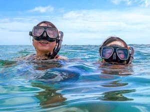 people snorkeling on a Galapagos cruise vacation