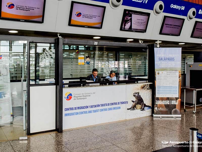 two people at a kiosk in an airport