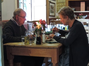people eating in a restaurant - one of the things to do in the Cotswolds