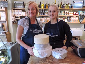 two women in a cheese shop