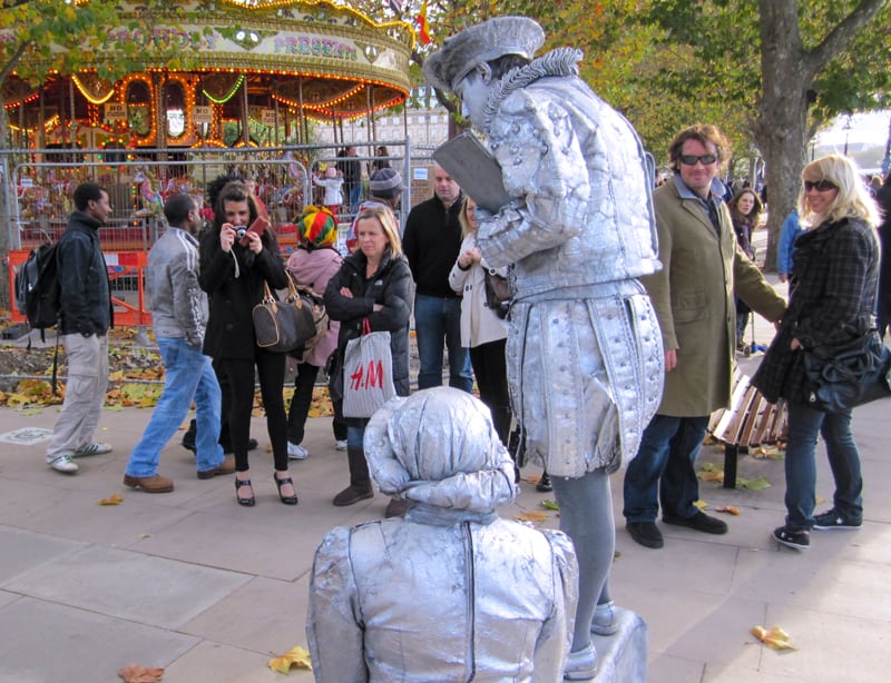 people around a group of mimes