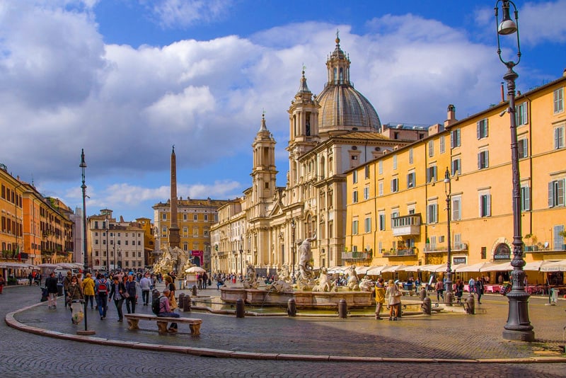 people in the Piazza Navona during a late afternoon