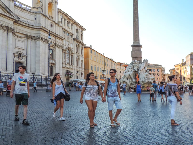 young people walking across the Piazza Navona