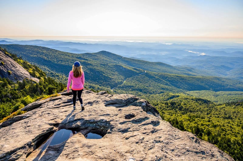a young woman looking out at the mountains in the North Carolina High Country