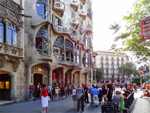 people on a European train trip looking at a picturesque building