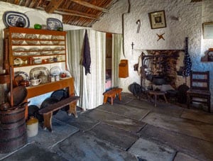 a cottage room with a slate floor