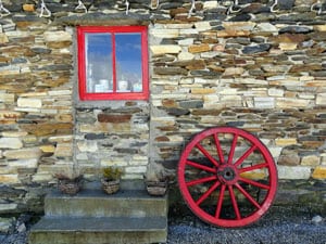 a red wagon wheel and red painted window