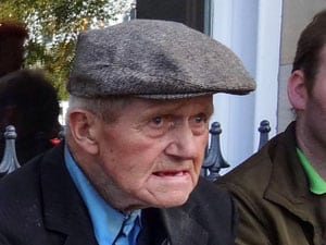 a man with a cap on in  in Donegal Ireland