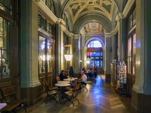 people in a cafe in a train station during a European trip