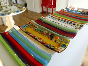 colorful glass trays in a craft shop