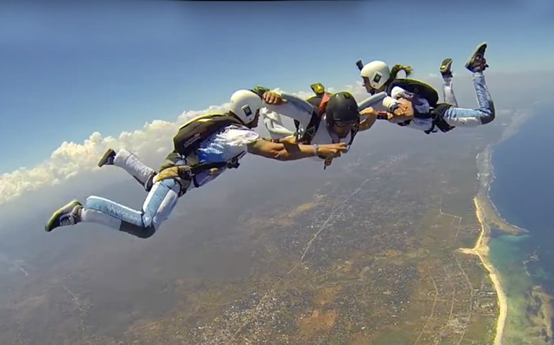 three people skydiving, one of the things to do in Kenya