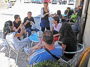 people at a small cafe