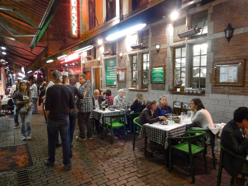 people at a crowded outdoor cafe