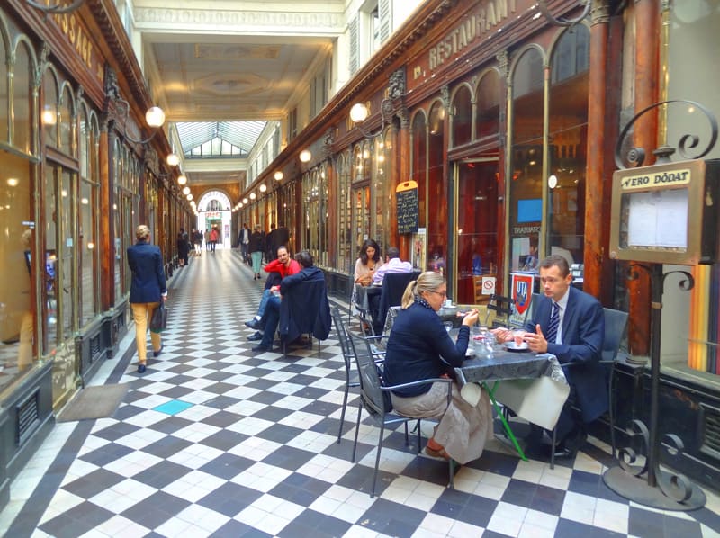 people having lunch in a long hallway
