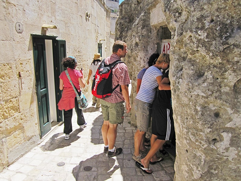 people looking into an cave