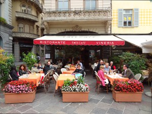 people in a cafe, one of the things to do in Lugano