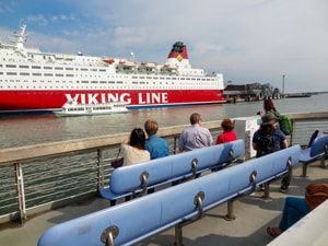 people looking at a cruise ship in Helsinki Harbor