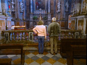 a couple standing in an ornate church