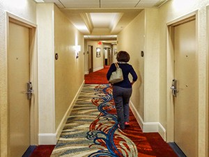 a woman walking in a hallway