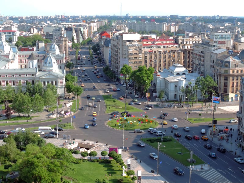 cars on a street in a modern city