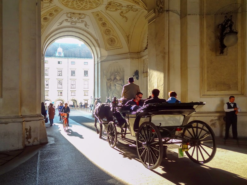 people on a horse drawn carriage ride - one of the things to do in Vienna