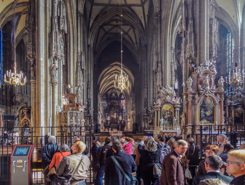 people in a crowded St. Stephens Cathedral - one of the things to do in Vienna