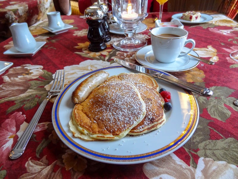 pancakes on a plate with other foods seen on a weekend getaway to Vermont