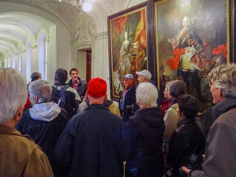 people by large paintings in Melk Abbey