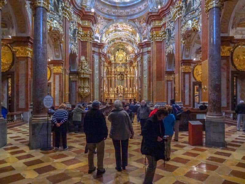 people in an ornate Baroque church