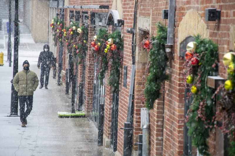 wreathes on a brick wall seen in Toronto in the winter