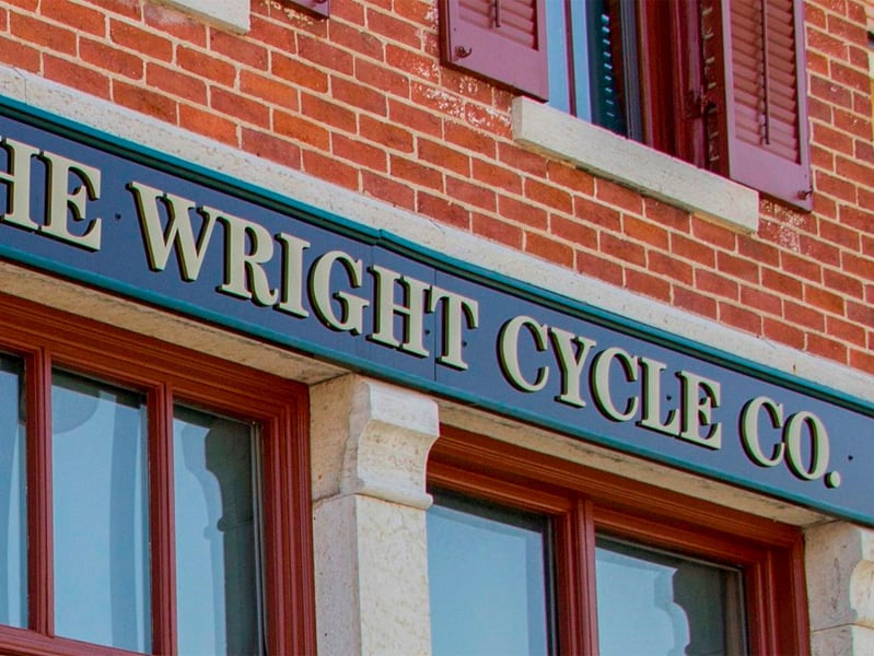 a sign on a building sayig The Wright Cycle Co.