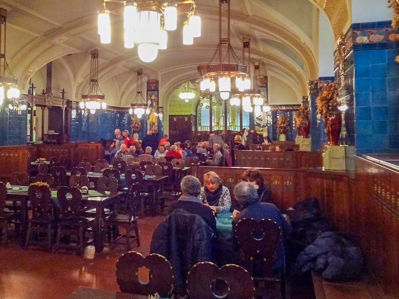 people sitting in an old beer hall restaurant