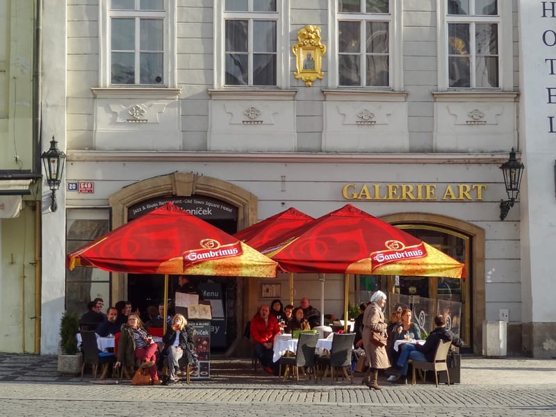 people sitting in an outdoor cafe in Prague in winter