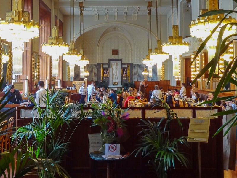 people sitting in an ornate restaurant
