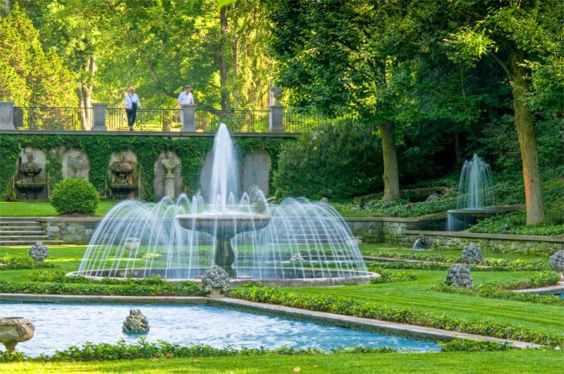 people looking at fountains in one of the best botanical gardens in the USA