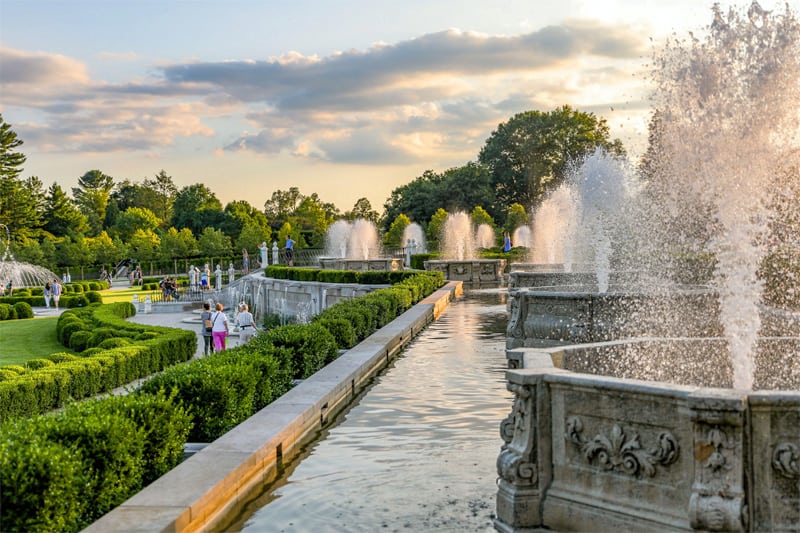 people walking by a series of fountains in one of the best botanical gardens in the USA